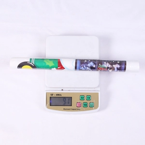 Weight measurement of a 91g roll of Christmas themed Merry Christmas wrapping stickers