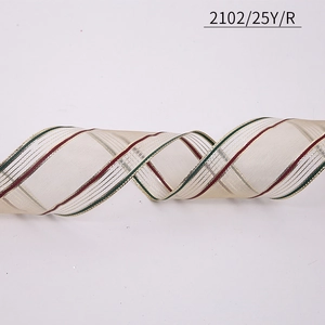 Close-up of Christmas wired ribbon with red and green stripes and gold accents