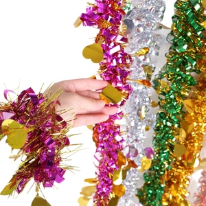 Christmas tinsel garland with heart sequins in pink, green, and silver for party decor