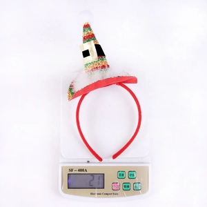Christmas headband weight display on a scale showing 21g for red festive party hat