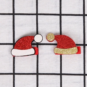 Fermagli natalizi con paillettes luccicanti e cappello di Babbo Natale per acconciature festive
