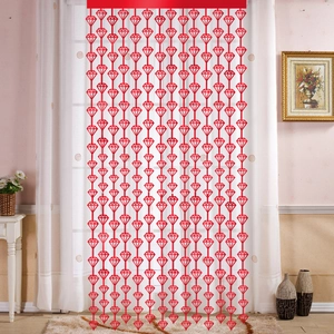 Detail of red diamond-shaped beaded curtain for party wall decor and wedding background