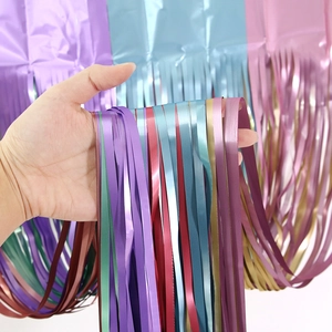 Detail of colorful metallic foil fringe curtains for party backdrop decoration