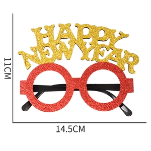 Lunettes rouges brillantes Happy New Year avec paillettes dorées pour fête de Noël