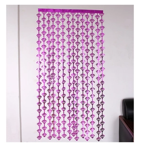 Close-up of diamond-shaped rose pink foil fringe curtain for party background wall decor