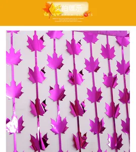 Macro detail of metallic purple maple leaf fringe curtain for Thanksgiving party decor