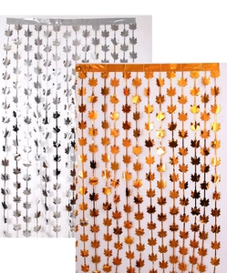 Detail of maple leaf metallic fringe curtains in gold and silver for Thanksgiving decor