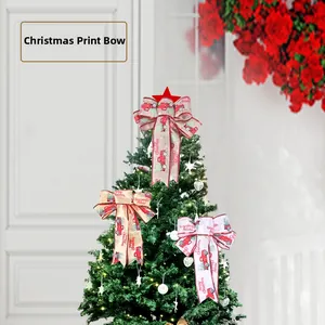 Close-up of Christmas linen bows with vintage red truck print on a decorated tree