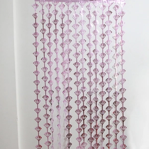 Close-up of metallic pink diamond-shaped foil curtain for wedding and party backdrop decoration
