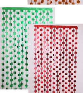 Detail of maple leaf shaped foil fringe curtains in metallic red, green and orange colors
