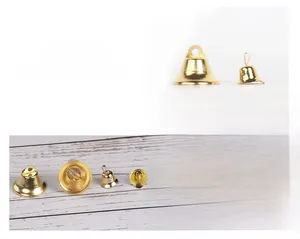 Detailed macro views of polished golden Christmas bells for DIY crafts and decorations