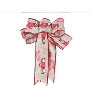 Detail of Christmas burlap bow featuring red vintage truck design and Merry Christmas text