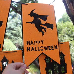 Orange and black Happy Halloween banner with felt witch and haunted house motifs
