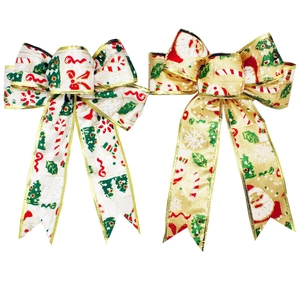 Detail of 20cm Christmas bows with Santa and tree patterns and gold wired edges
