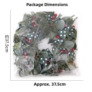 Christmas wreath detail in plastic bag with dimensions showing green pine and red berries