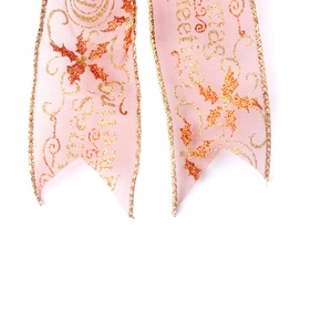 Pink sheer Christmas ribbon with gold Merry Christmas print and wired edges for decor