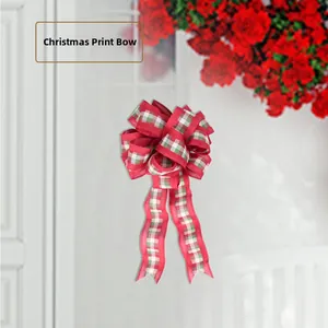 Close-up of a festive Christmas printed bow with red, green, and white plaid fabric details