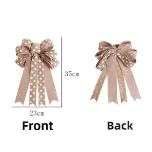 Detailed size view of linen-style Christmas bow with white polka dots, 23cm by 35cm