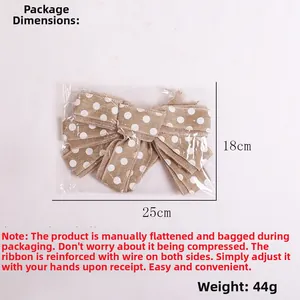 Detailed packaging view showing 25x18cm faux burlap Christmas bow with white polka dots