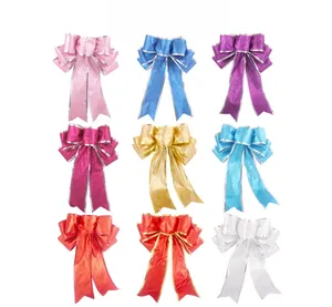 Detail view of 20cm glitter Christmas bows in nine colors for festive tree decoration