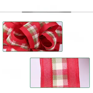 Detail of red Christmas ribbon with green and white plaid edges showing high density fabric