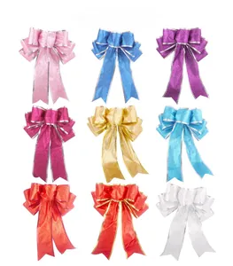 Detail view of 20cm glitter Christmas bows in nine colors for festive tree decoration