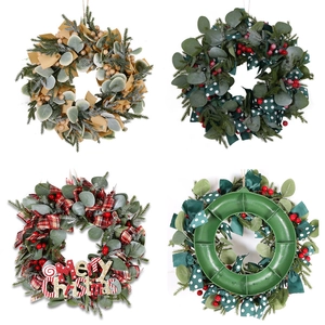 Christmas wreath collection with Santa ribbons, berries, and artificial foliage decor