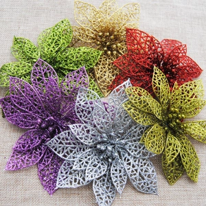 Macro detail of artificial Christmas flowers with glitter coating and hollow petals
