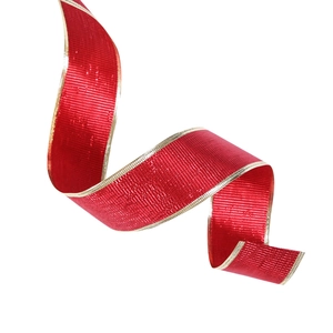Detail of 10m red Christmas ribbon with gold edges and metallic woven texture