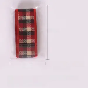Detail view of 2-meter red and black plaid Christmas ribbon in clear packaging