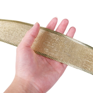 Close-up of 10m metallic gold Christmas ribbon with textured weave and embossed edges