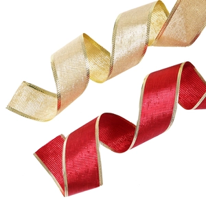 Detail of red and champagne gold Christmas ribbons with elegant gold edges and textures