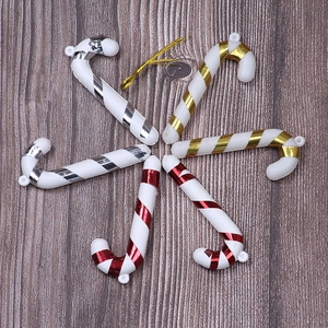 Close-up of 6 pack colorful striped candy cane ornaments in red, gold and silver