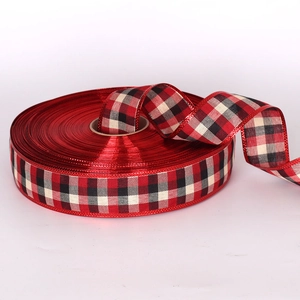 Red metallic Christmas ribbon with classic plaid edges for tree decoration and gift wrapping