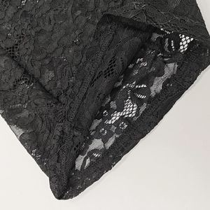 Detail of elegant black lace fabric with floral embroidery and hollow-out texture