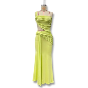 Detailed view of the side cutout and ruched fabric on the lime green one shoulder maxi dress