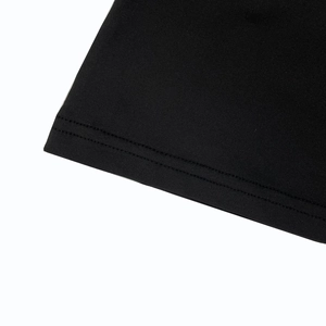 Detailed close-up of double-stitched hem on black knitted summer halter top