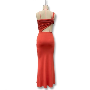 Detail of rust red ruched dress showing side ruching and backless asymmetric cut