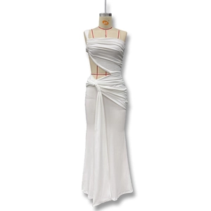 Detail of white one-shoulder dress featuring waist cut-out and ruched skirt design