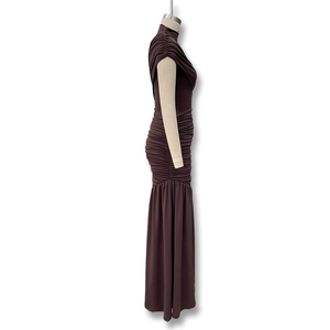 Detail view of the side profile on a brown sleeveless bodycon dress with ruching