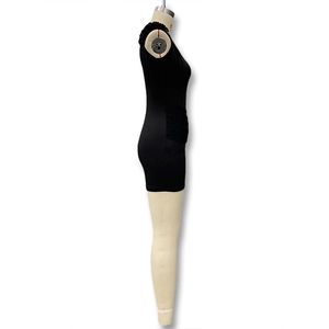 Detail view of black bodycon dress featuring side ruching and elegant neck ribbon detail
