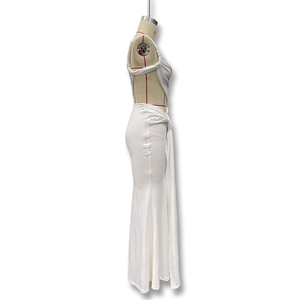 Detail of white backless dress featuring side cut-outs and ruched twist knot design