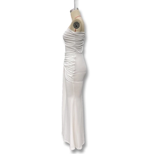 Detail view of white off-shoulder ruched dress with side pleats and slim-fit maxi silhouette