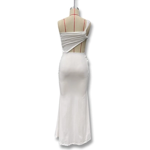 Detail view of white backless dress with ruched fabric and asymmetric one-shoulder design