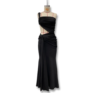 Detail view of black one-shoulder dress featuring ruched fabric and side cutout design