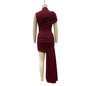 Detail of burgundy one-shoulder dress with elegant pleats and asymmetrical draped hemline