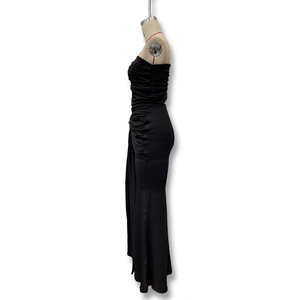 Detail of elegant black strapless bodycon dress with side ruching and pleated textures