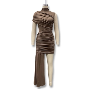 Detail of ruched coffee dress showing slim fit design and asymmetric floor-length drape