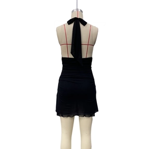 Back view of black halter mini dress with large bow knot and ruched detailing