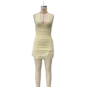 Sexy light yellow halter neck mini dress with deep V-neck and ruched details